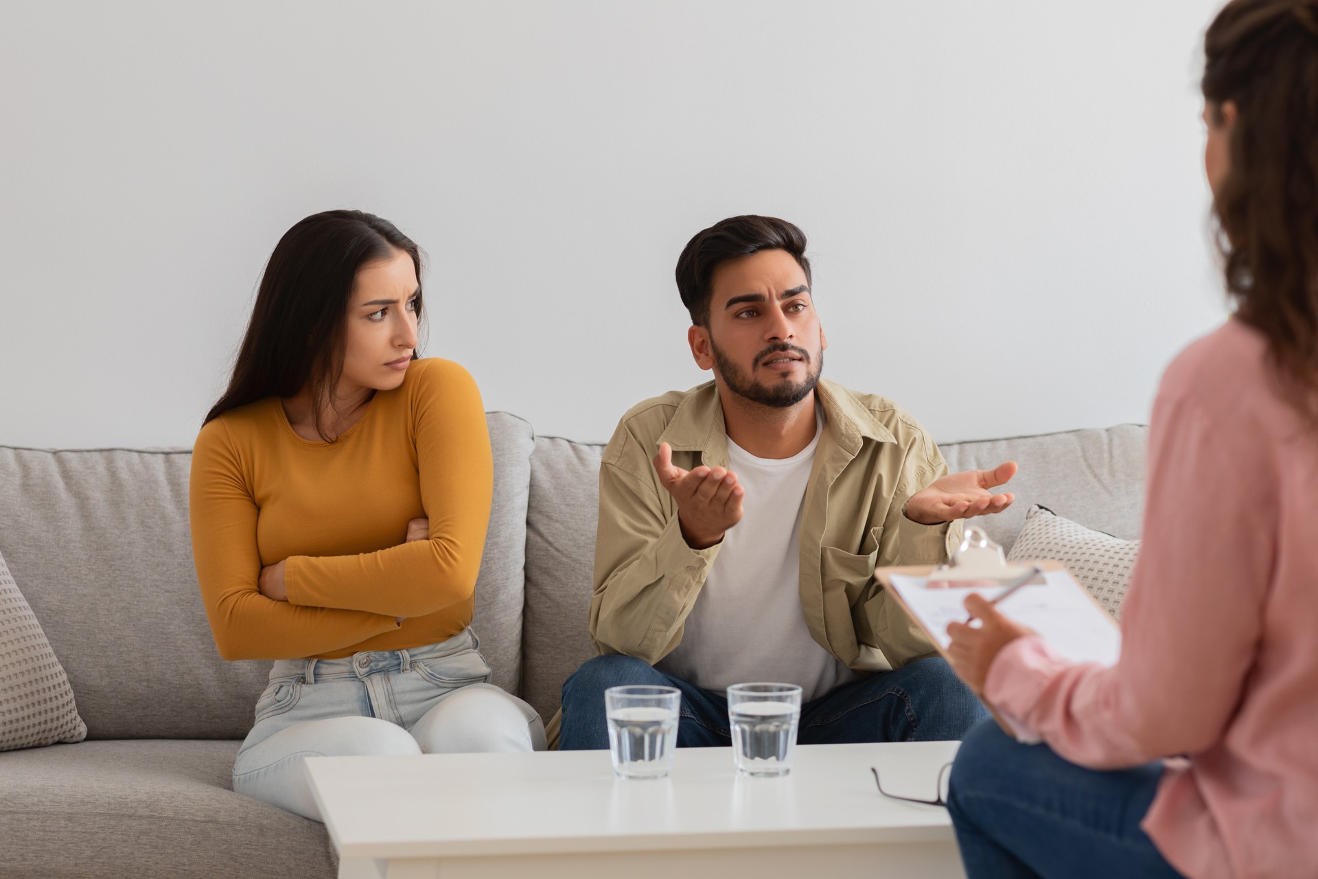 Young couple in therapy session, crisis in relationships